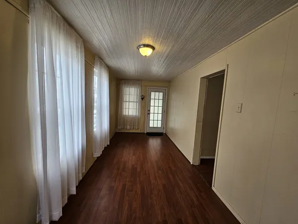 a view of gallery with wooden floor