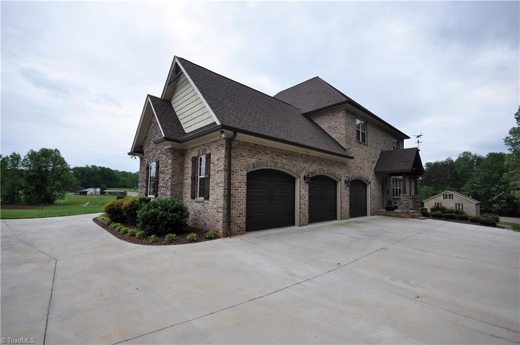 5849 Pepper Road Oak Ridge, NC 27310 - Photo 23 of 28 3 car side load garage