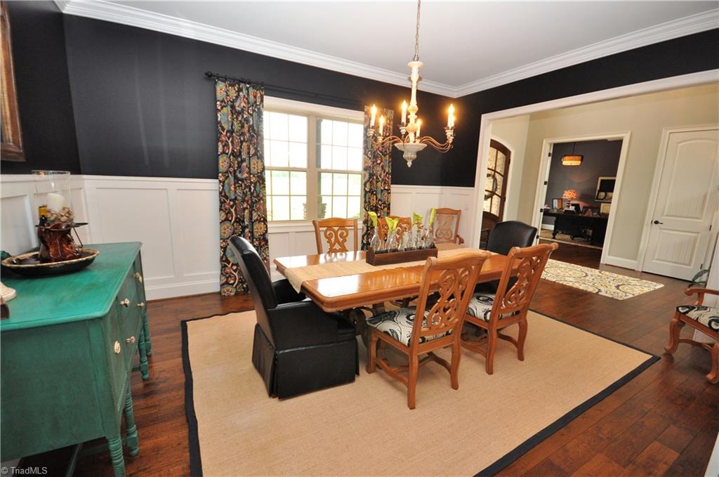 5849 Pepper Road Oak Ridge, NC 27310 - Photo 4 of 28 Large dining area with wainscoting