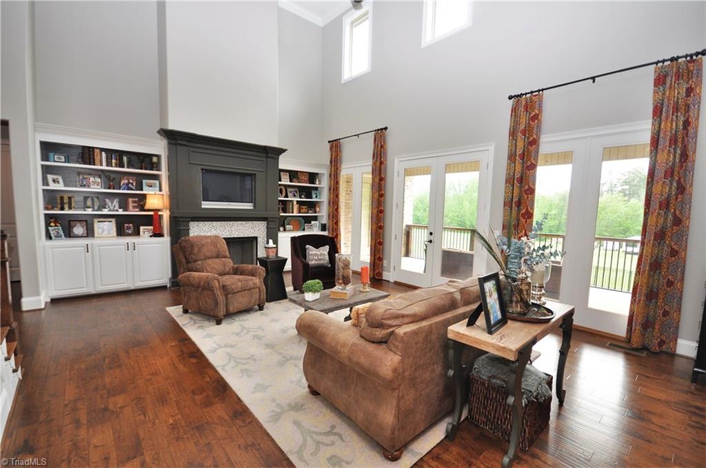 5849 Pepper Road Oak Ridge, NC 27310 - Photo 6 of 28 The high ceilings, fireplace, wood floors and built-ins make this a great place to visit