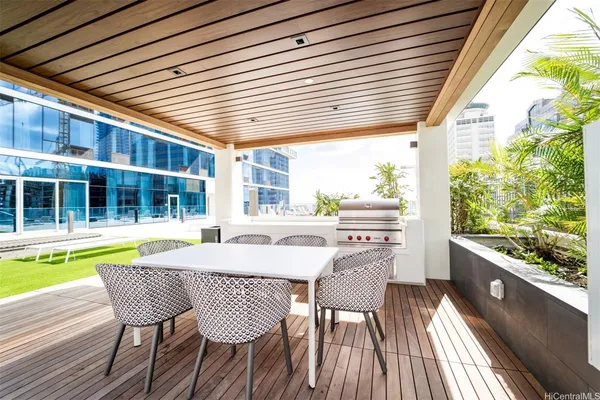 a view of a dining room with furniture and balcony