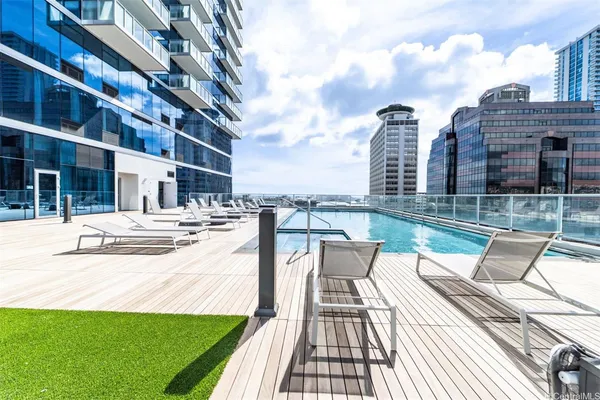 a very nice looking room with many windows and furniture