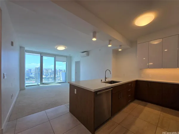 a kitchen with stainless steel appliances granite countertop a sink and a stove