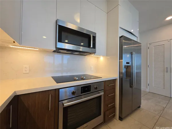 a kitchen with a stove and a microwave