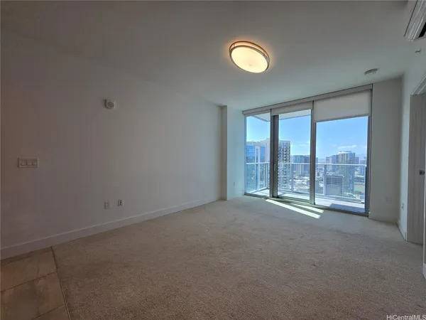 a view of an empty room with a window