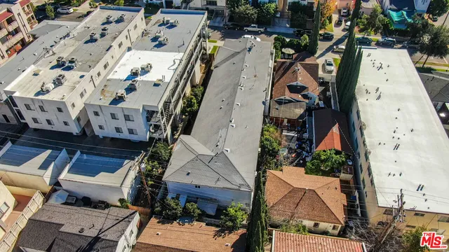 an aerial view of a house with a garden