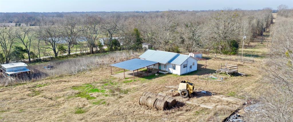 5194 County Road Pattonville, TX 75468 - Photo 1 of 17 a view of a backyard with wooden fence