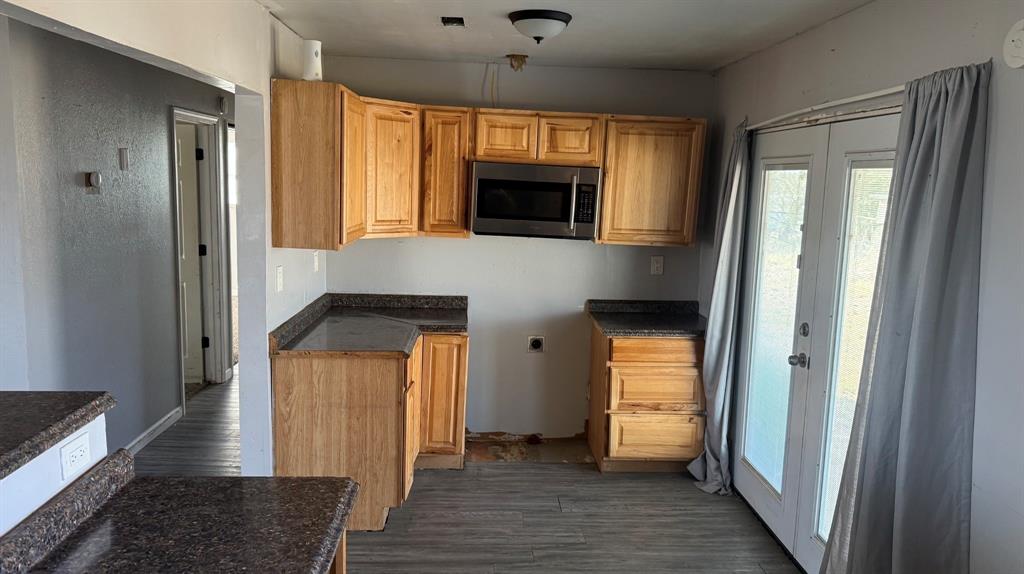 5194 County Road Pattonville, TX 75468 - Photo 13 of 17 a hallway with wooden floor and windows