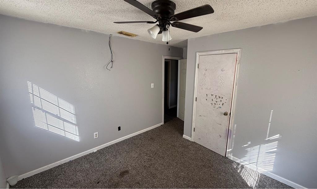 5194 County Road Pattonville, TX 75468 - Photo 14 of 17 a view of a livingroom with a ceiling fan and window