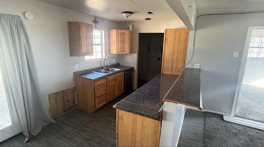 5194 County Road Pattonville, TX 75468 - Photo 15 of 17 an empty room with wooden floor and windows