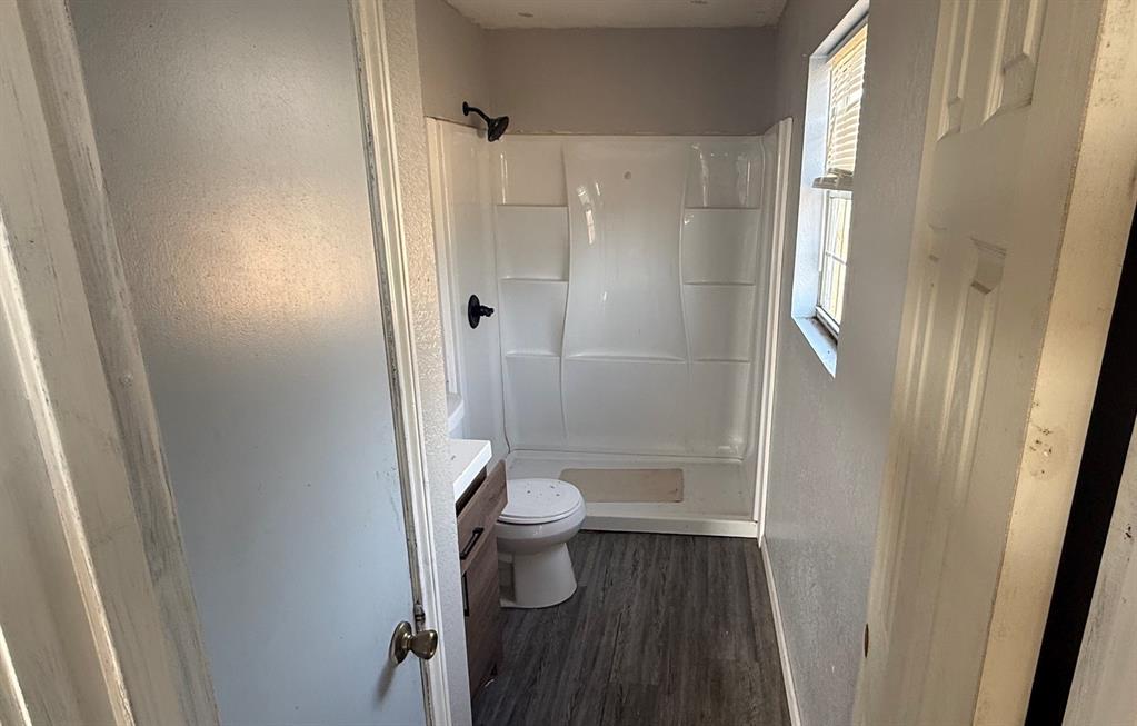 5194 County Road Pattonville, TX 75468 - Photo 16 of 17 a bathroom with a shower and toilet