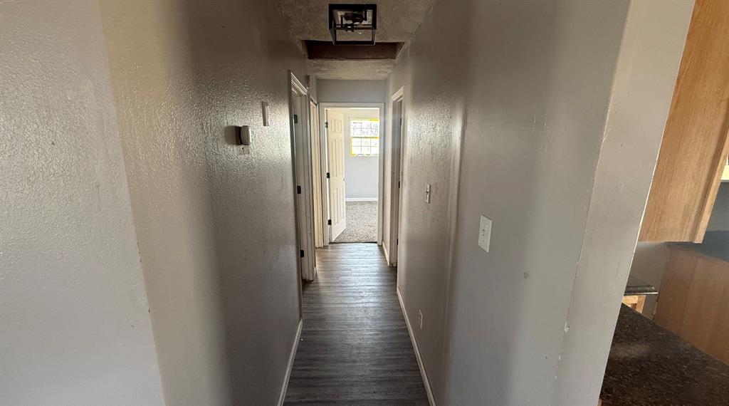 5194 County Road Pattonville, TX 75468 - Photo 17 of 17 a view of a hallway with wooden floor