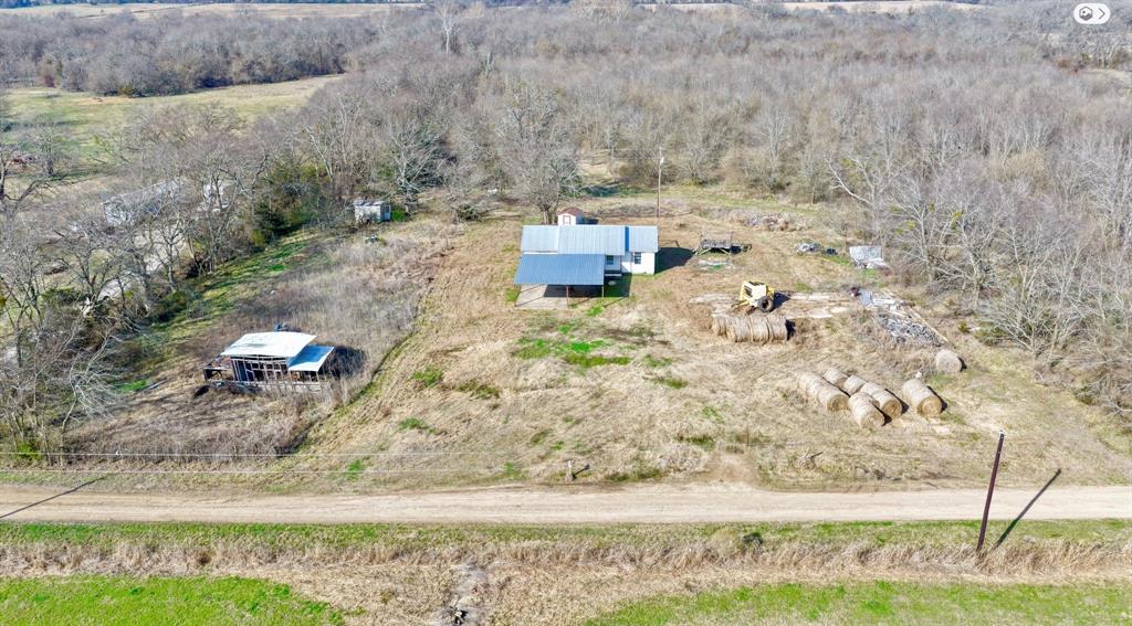 5194 County Road Pattonville, TX 75468 - Photo 2 of 17 a backyard of a house with lots of green space