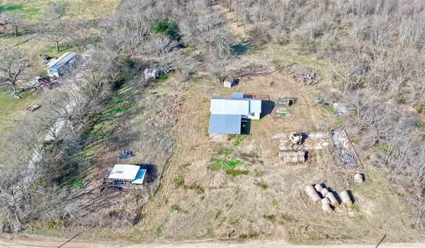 a aerial view of a house with a yard
