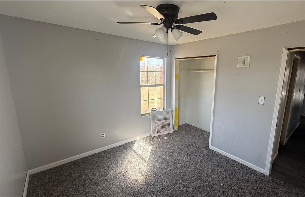5194 County Road Pattonville, TX 75468 - Photo 9 of 17 a view of an empty room with a window