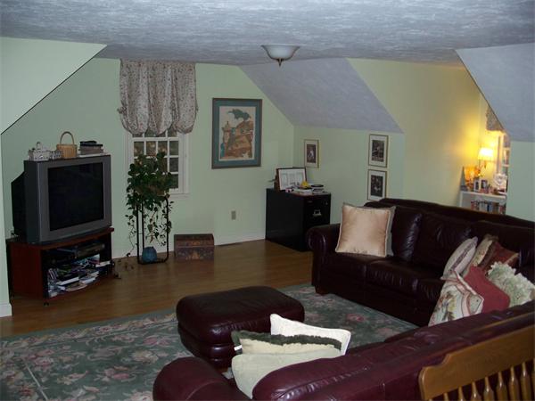 164 Kettle Hole Road Bolton, MA 01740 - Photo 12 of 28 a living room with furniture and a flat screen tv
