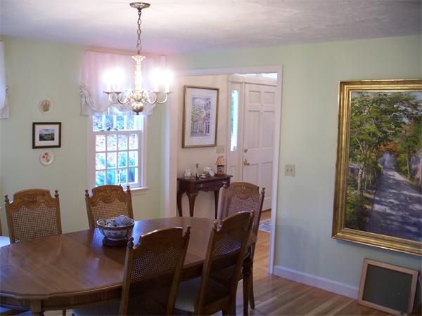 164 Kettle Hole Road Bolton, MA 01740 - Photo 13 of 28 a view of a dining room with furniture and chandelier