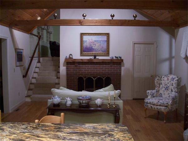 164 Kettle Hole Road Bolton, MA 01740 - Photo 17 of 28 a living room with furniture and a fireplace