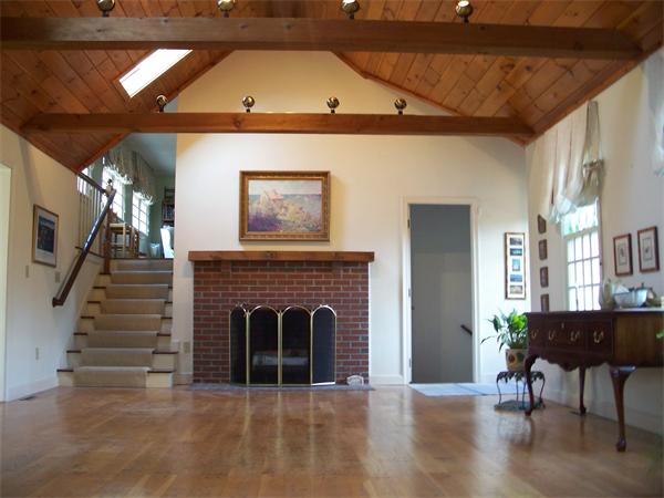 164 Kettle Hole Road Bolton, MA 01740 - Photo 18 of 28 a living room with furniture and a fireplace