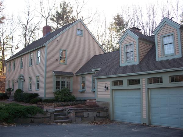 164 Kettle Hole Road Bolton, MA 01740 - Photo 19 of 28 a front view of a house with garage