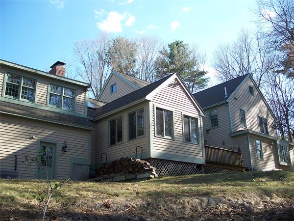 164 Kettle Hole Road Bolton, MA 01740 - Photo 21 of 28 a view of a house with a yard