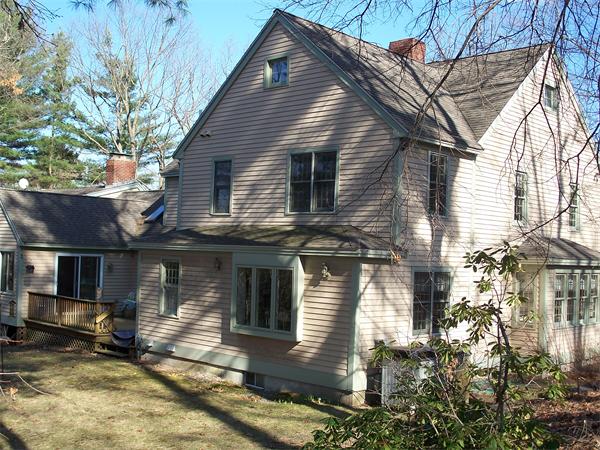 164 Kettle Hole Road Bolton, MA 01740 - Photo 22 of 28 a front view of a house with a yard