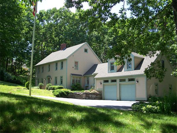 164 Kettle Hole Road Bolton, MA 01740 - Photo 25 of 28 a view of a white house with a big yard and large trees