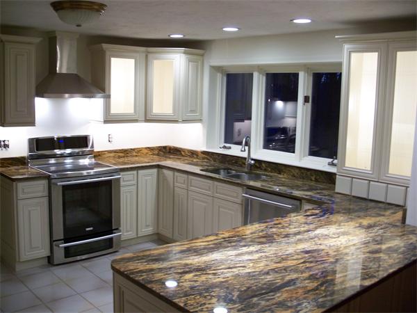 164 Kettle Hole Road Bolton, MA 01740 - Photo 4 of 28 a kitchen with granite countertop a sink and a stove top oven