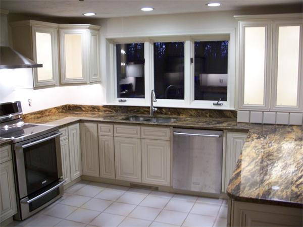164 Kettle Hole Road Bolton, MA 01740 - Photo 7 of 28 a kitchen with granite countertop a sink and a stove