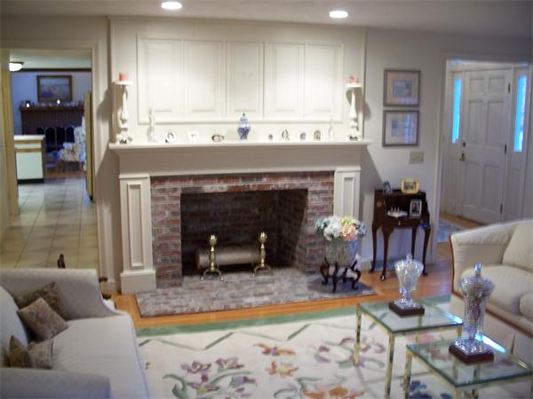 164 Kettle Hole Road Bolton, MA 01740 - Photo 10 of 28 a living room with furniture and a fireplace