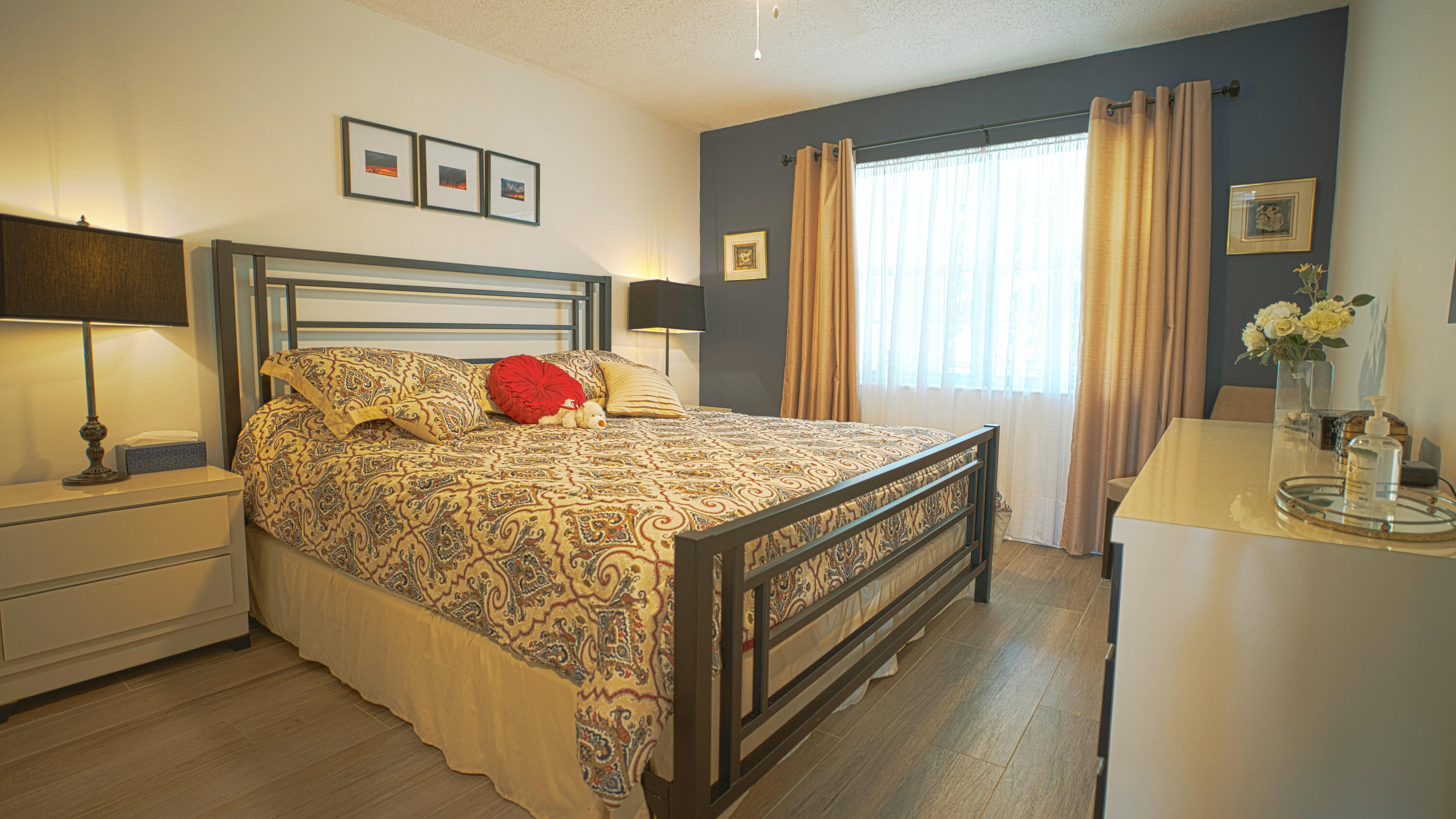 240 Windsor K West Palm Beach, FL 33417 - Photo 11 of 30 a bed sitting in a bedroom next to a window