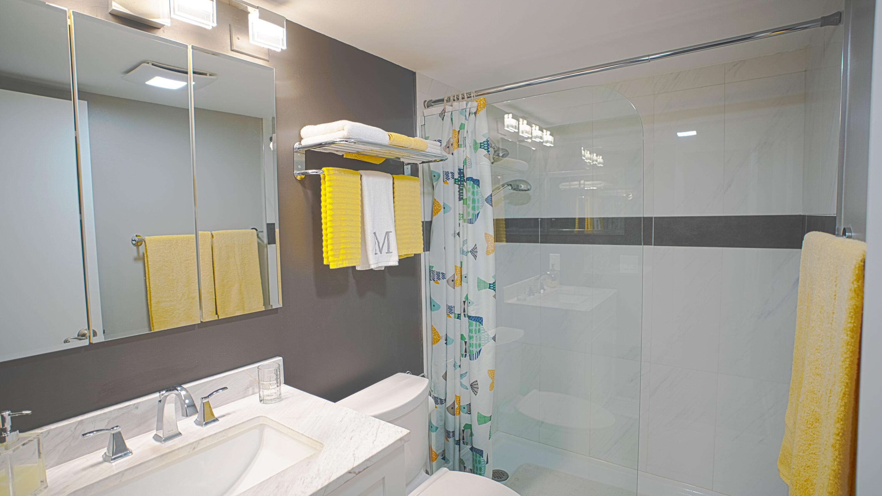 240 Windsor K West Palm Beach, FL 33417 - Photo 13 of 30 a bathroom with a sink and a mirror