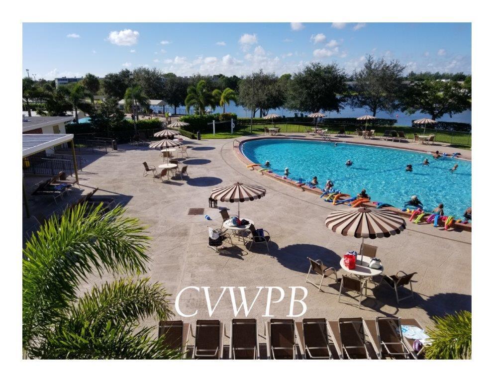 240 Windsor K West Palm Beach, FL 33417 - Photo 25 of 30 a view of swimming pool and outdoor seating