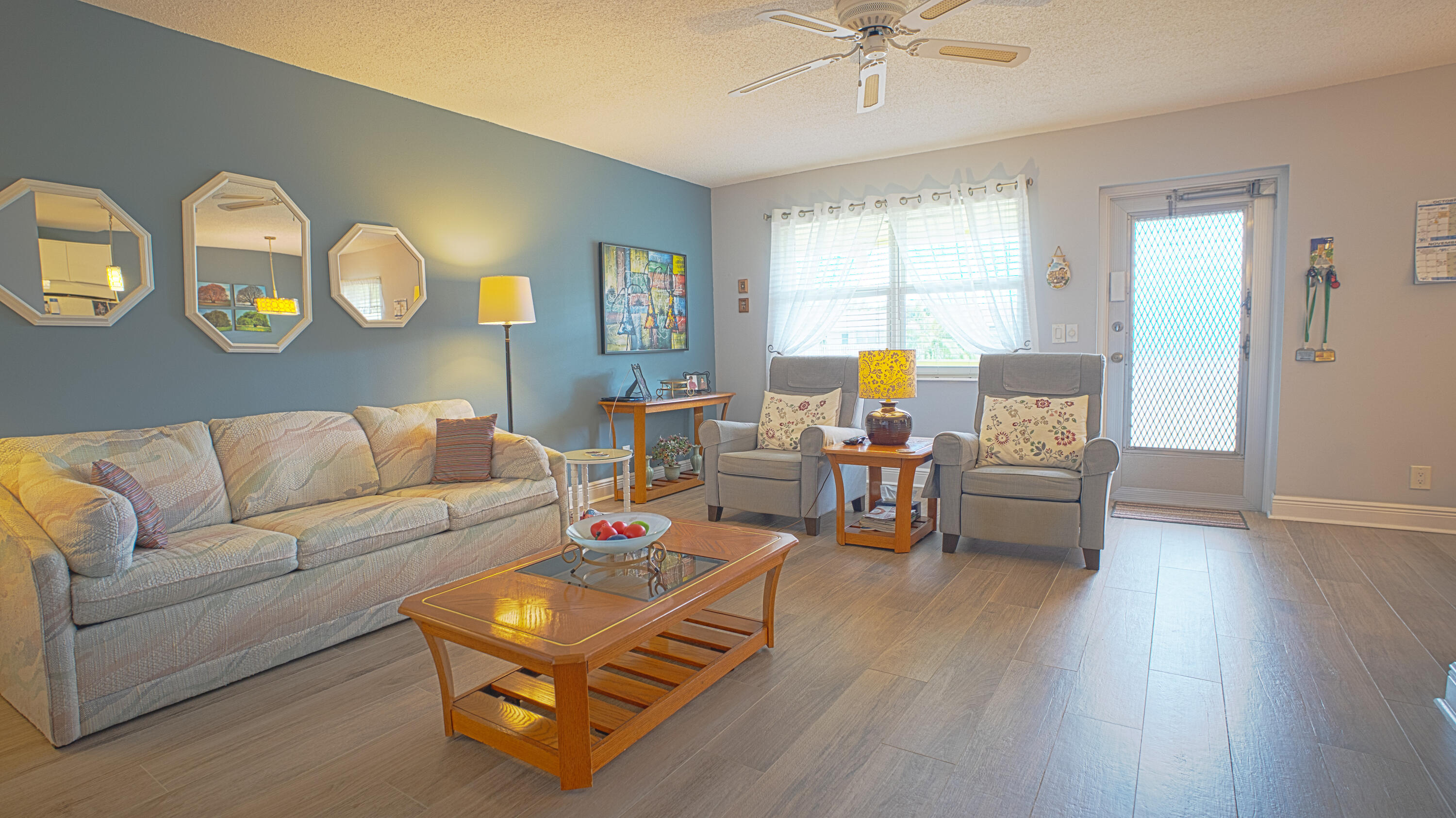 240 Windsor K West Palm Beach, FL 33417 - Photo 3 of 30 a living room with furniture and a wooden floor