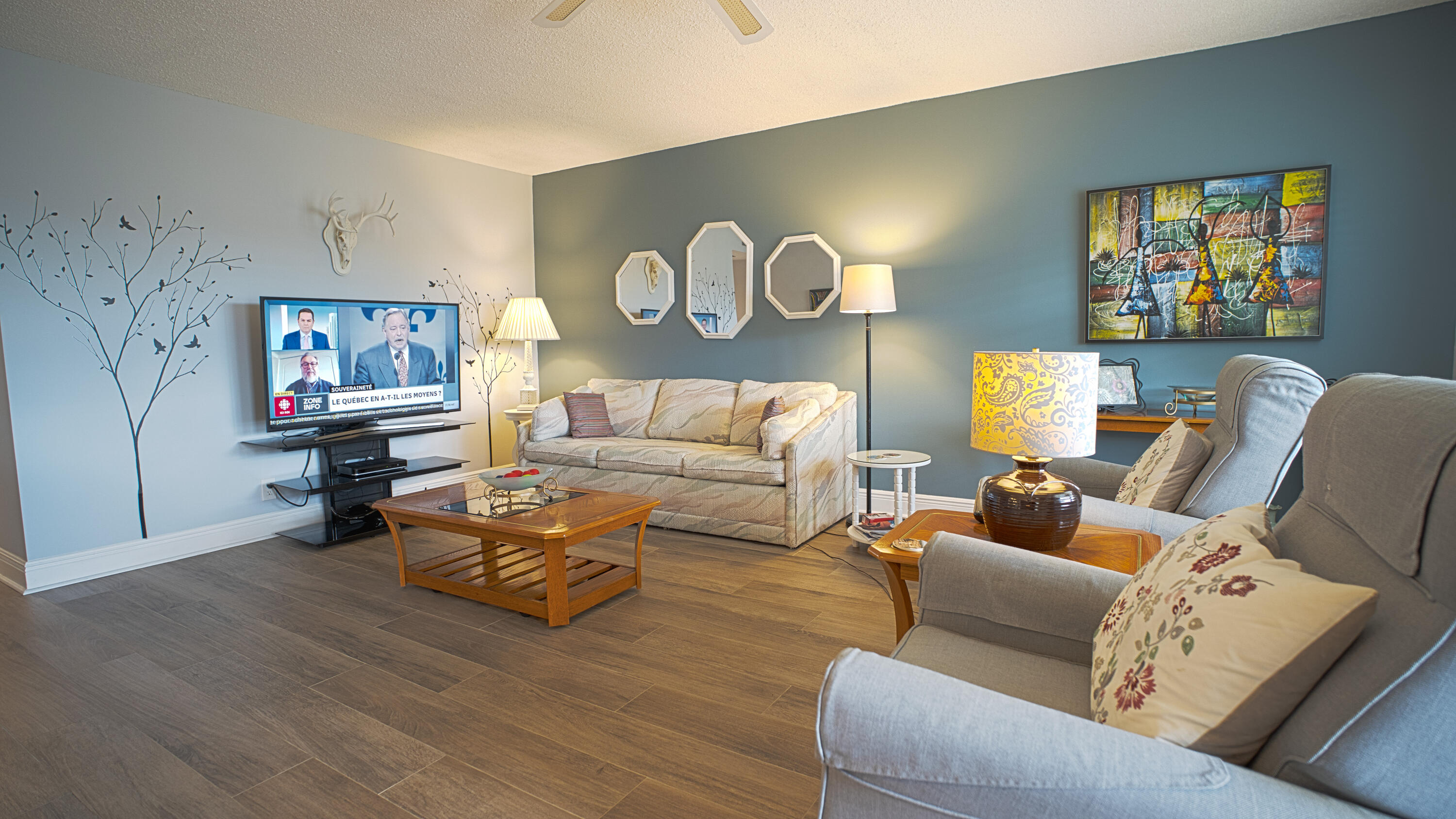 240 Windsor K West Palm Beach, FL 33417 - Photo 4 of 30 a living room with furniture and painting on the wall