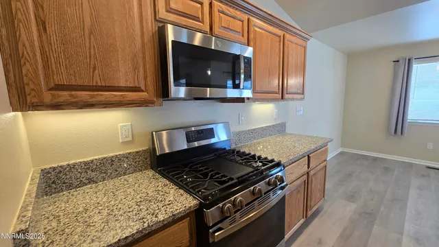 a kitchen with a stove and a microwave