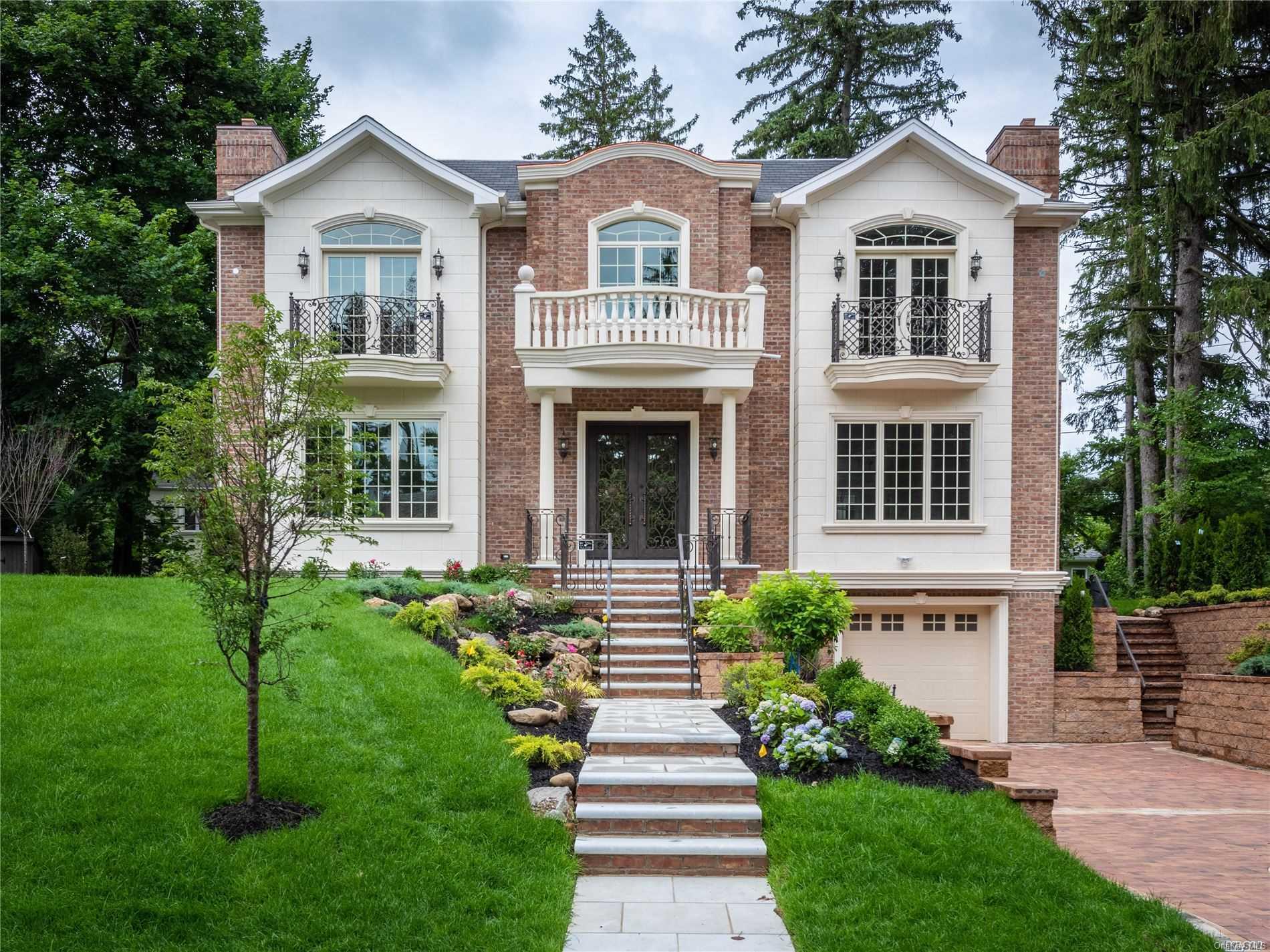 38 Strathmore Road Great Neck, NY 11023 - Photo 1 of 1 a front view of a house with garden