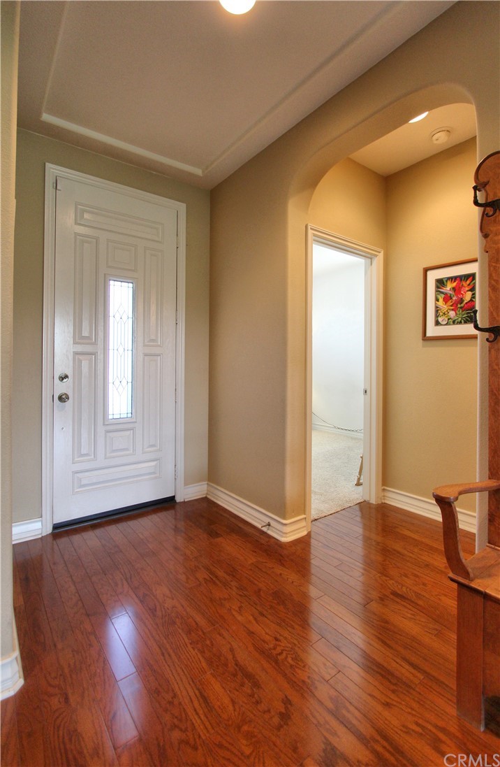 35107 Hogan Drive Beaumont, CA 92223 - Photo 13 of 42 a view of an empty room with wooden floor and a window