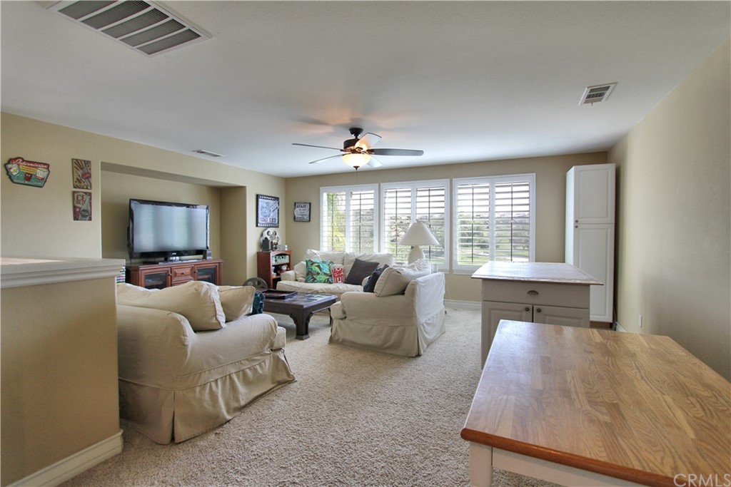 35107 Hogan Drive Beaumont, CA 92223 - Photo 18 of 42 a living room with furniture and a large window