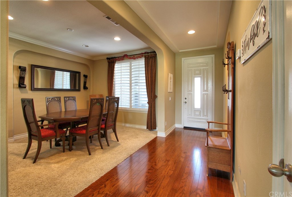 35107 Hogan Drive Beaumont, CA 92223 - Photo 2 of 42 a view of a dining room with furniture window and wooden floor