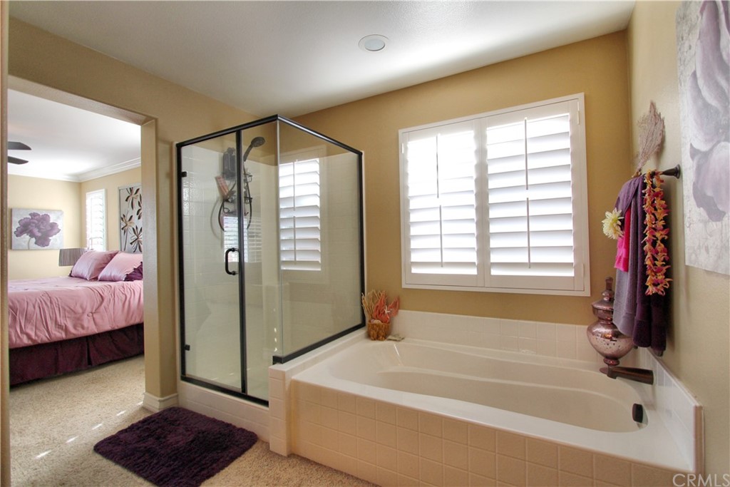 35107 Hogan Drive Beaumont, CA 92223 - Photo 29 of 42 a spacious bathroom with a tub shower and window