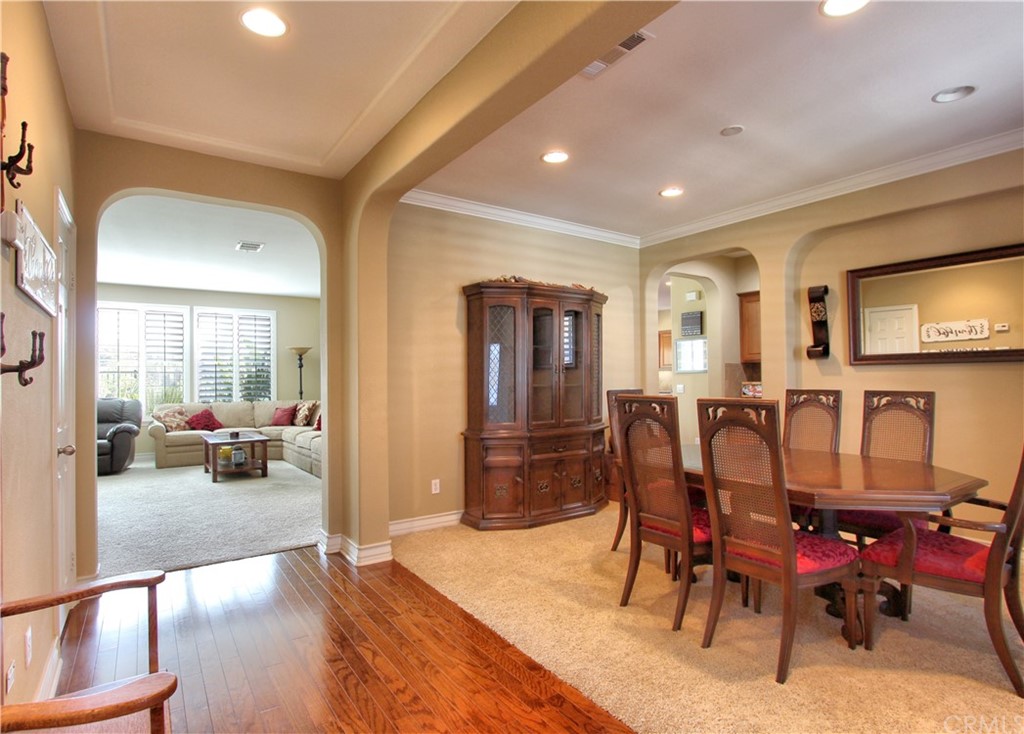35107 Hogan Drive Beaumont, CA 92223 - Photo 3 of 42 a view of a dining room with furniture window and wooden floor