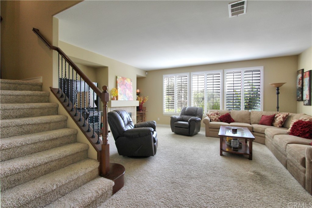 35107 Hogan Drive Beaumont, CA 92223 - Photo 4 of 42 a living room with furniture gym equipment and a large window