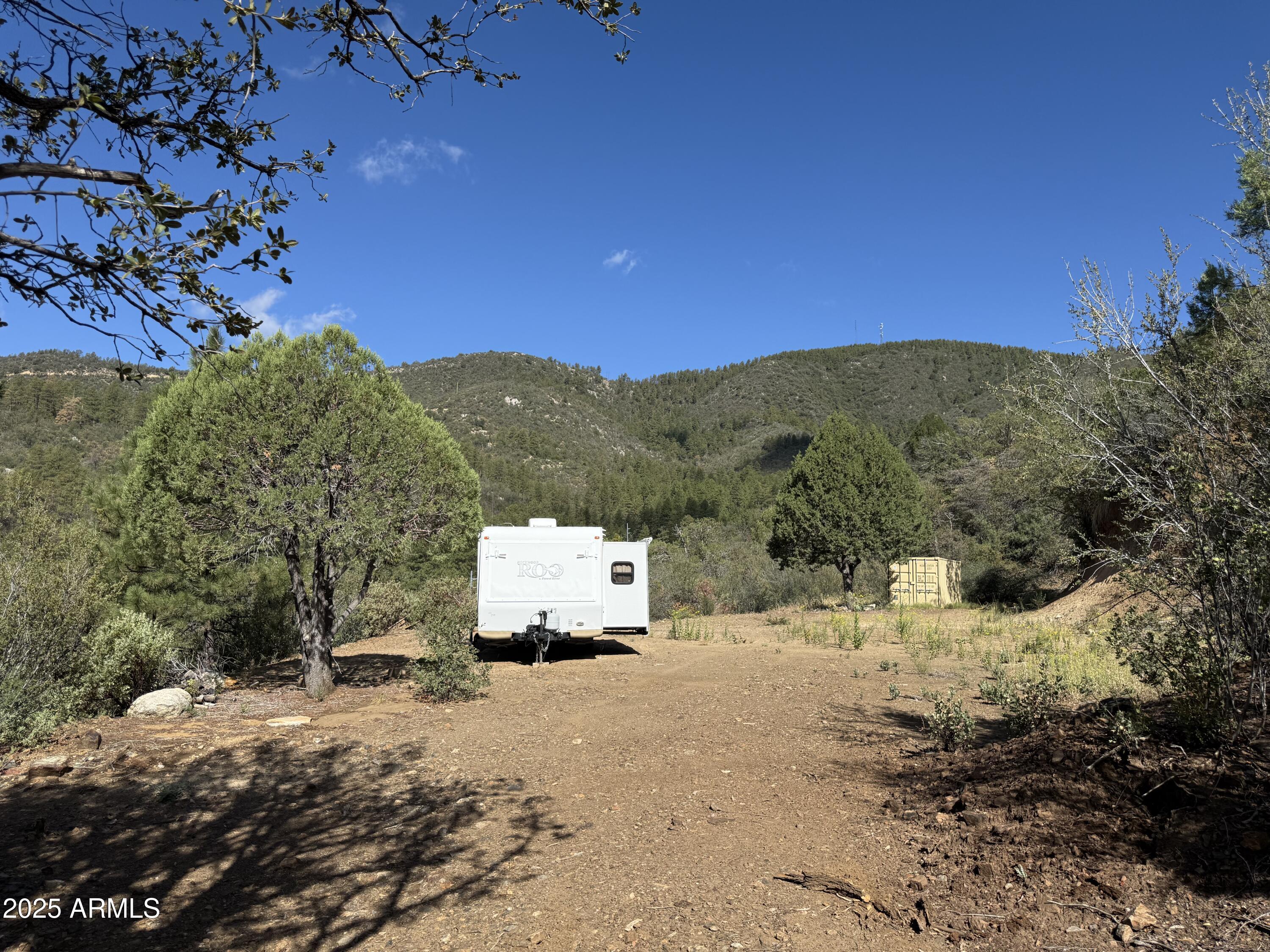 22865 South Gladiator Mine Road Crown King, AZ 86343 - Photo 11 of 20 a view of the road with a house in the background