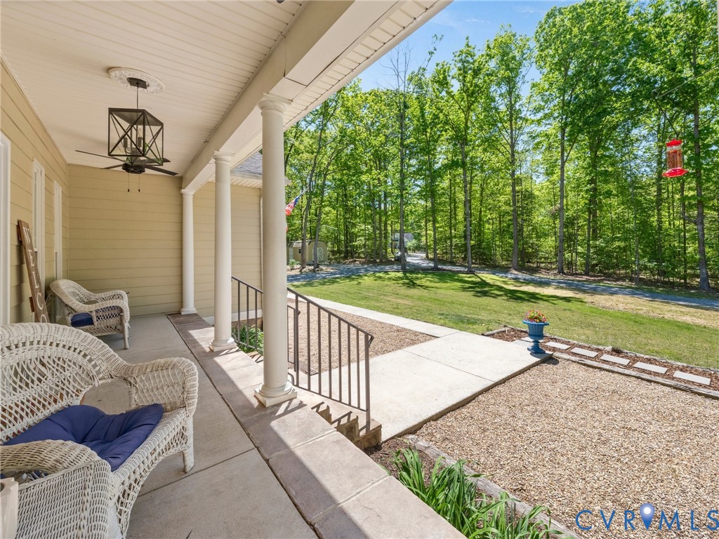 6126 Autumn Bluff Road Powhatan, VA 23139 - Photo 3 of 47 a view of a porch with furniture and a yard