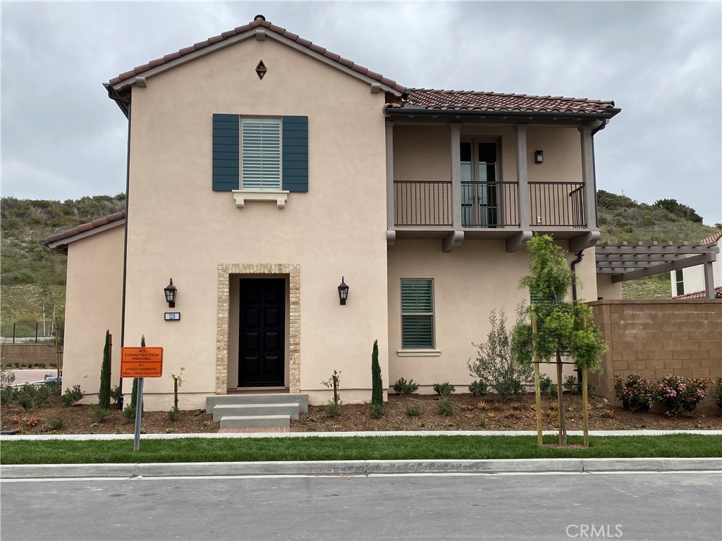 120 Spotted Quail Irvine, CA 92618 - Photo 1 of 32 a front view of a house with a yard and garage