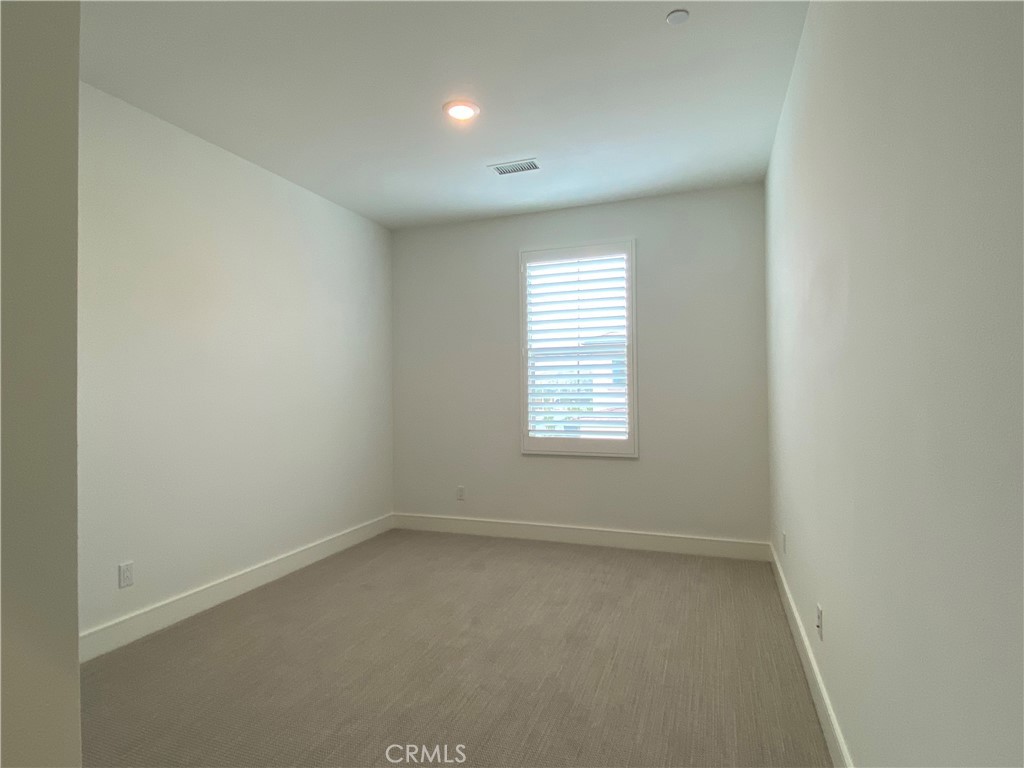120 Spotted Quail Irvine, CA 92618 - Photo 19 of 32 an empty room with a window