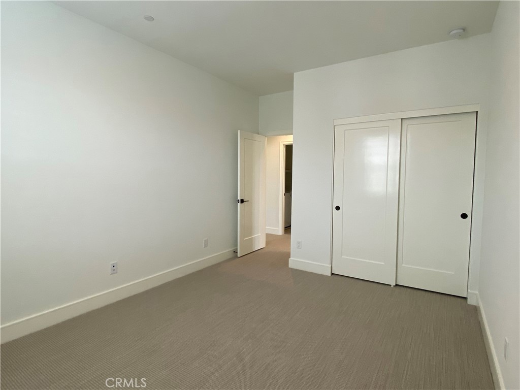 120 Spotted Quail Irvine, CA 92618 - Photo 20 of 32 an empty room with closet area