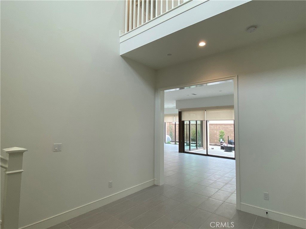 120 Spotted Quail Irvine, CA 92618 - Photo 2 of 32 wooden floor in a hall with an entryway