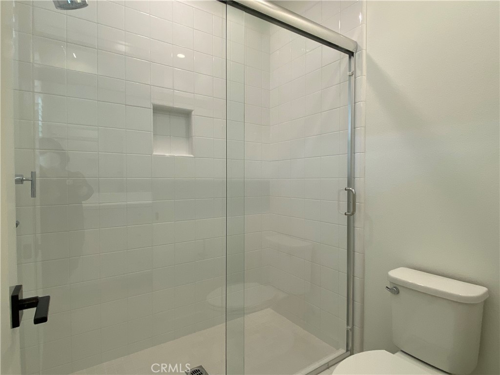 120 Spotted Quail Irvine, CA 92618 - Photo 22 of 32 a bathroom with a shower and a toilet